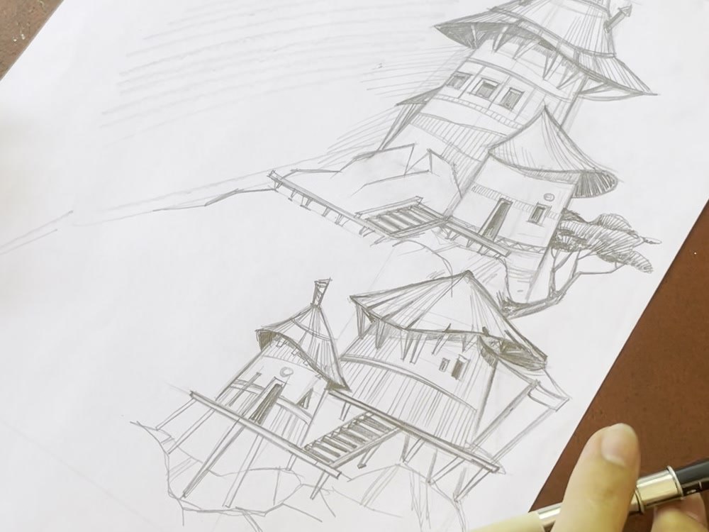 Aliya sketching fantasy towers in pencil, step by step