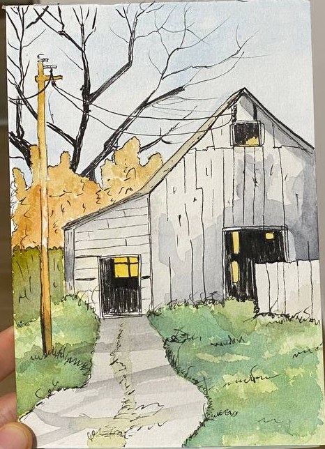 Emil's watercolour and ink sketch of an old grey barn with lit windows and autumn trees
